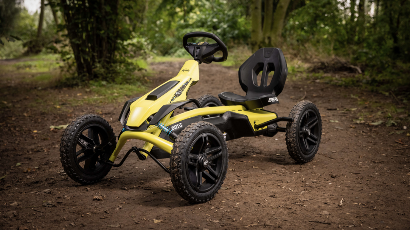 BERG Rally DRT Yellow 3 Gear pedal go-kart in garden