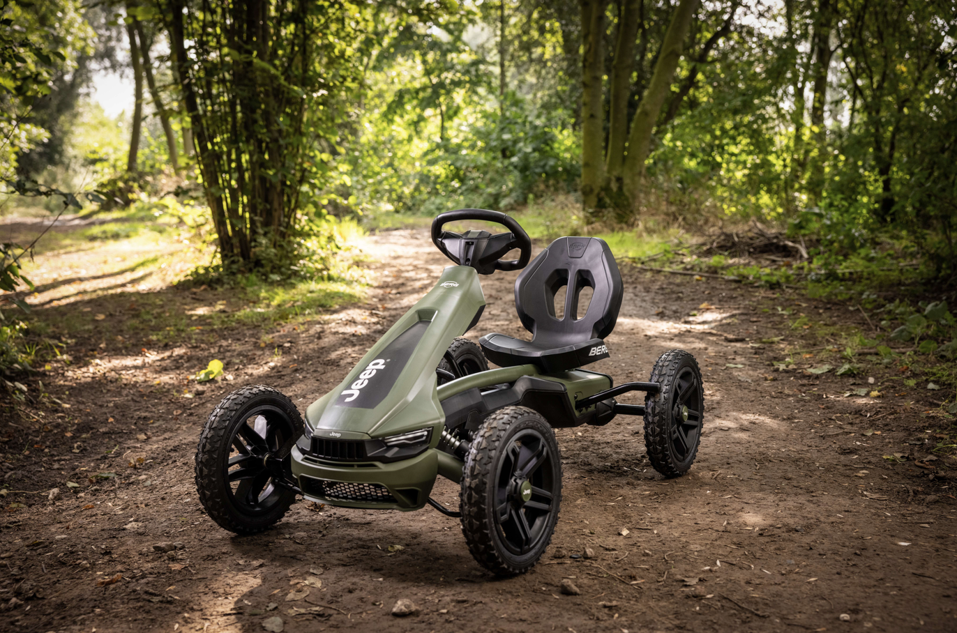 BERG Rally Jeep Cherokee pedal go-kart in garden