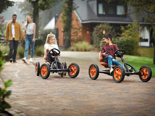 Child riding BERG Buddy PRO pedal go-kart outdoors