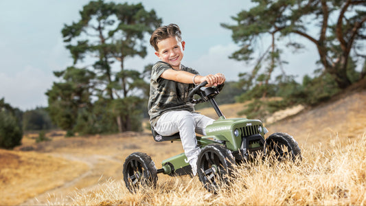 Child riding BERG Buzzy Sahara pedal go-kart outdoors