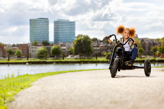 Child riding BERG Choopy Neo outdoors