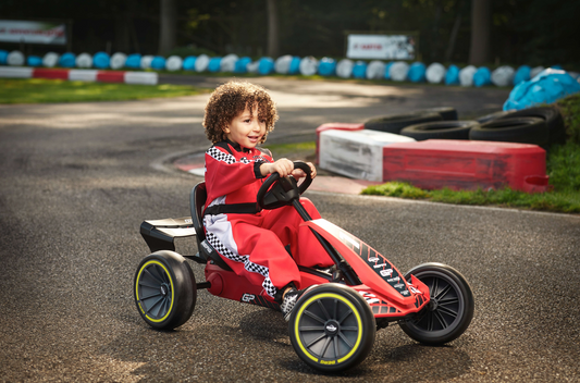 Child riding BERG Reppy GP pedal go-kart outdoors
