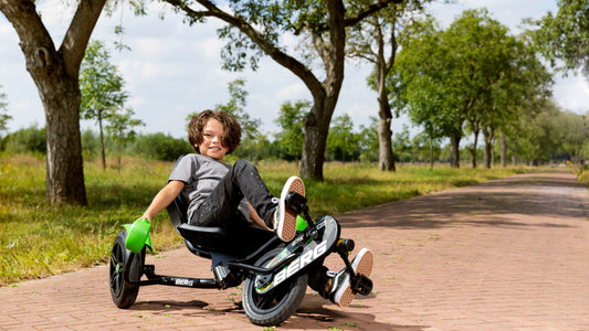 Child riding BERG Street X Venom pedal go-kart outdoors