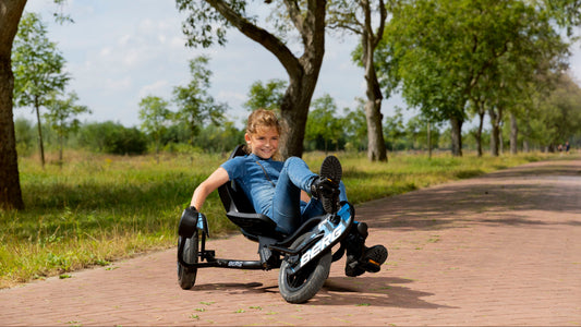 Child riding BERG Street-X Vibes pedal go-kart outdoors
