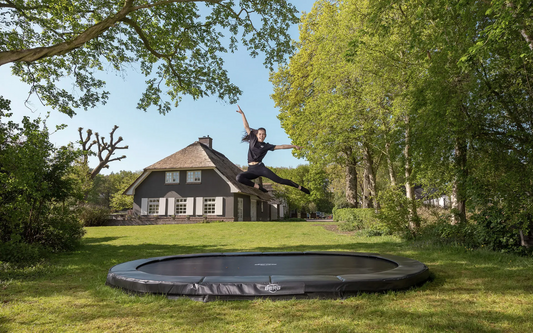 BERG Champion InGround and BERG Favorit InGround trampolines compared in an Irish family garden