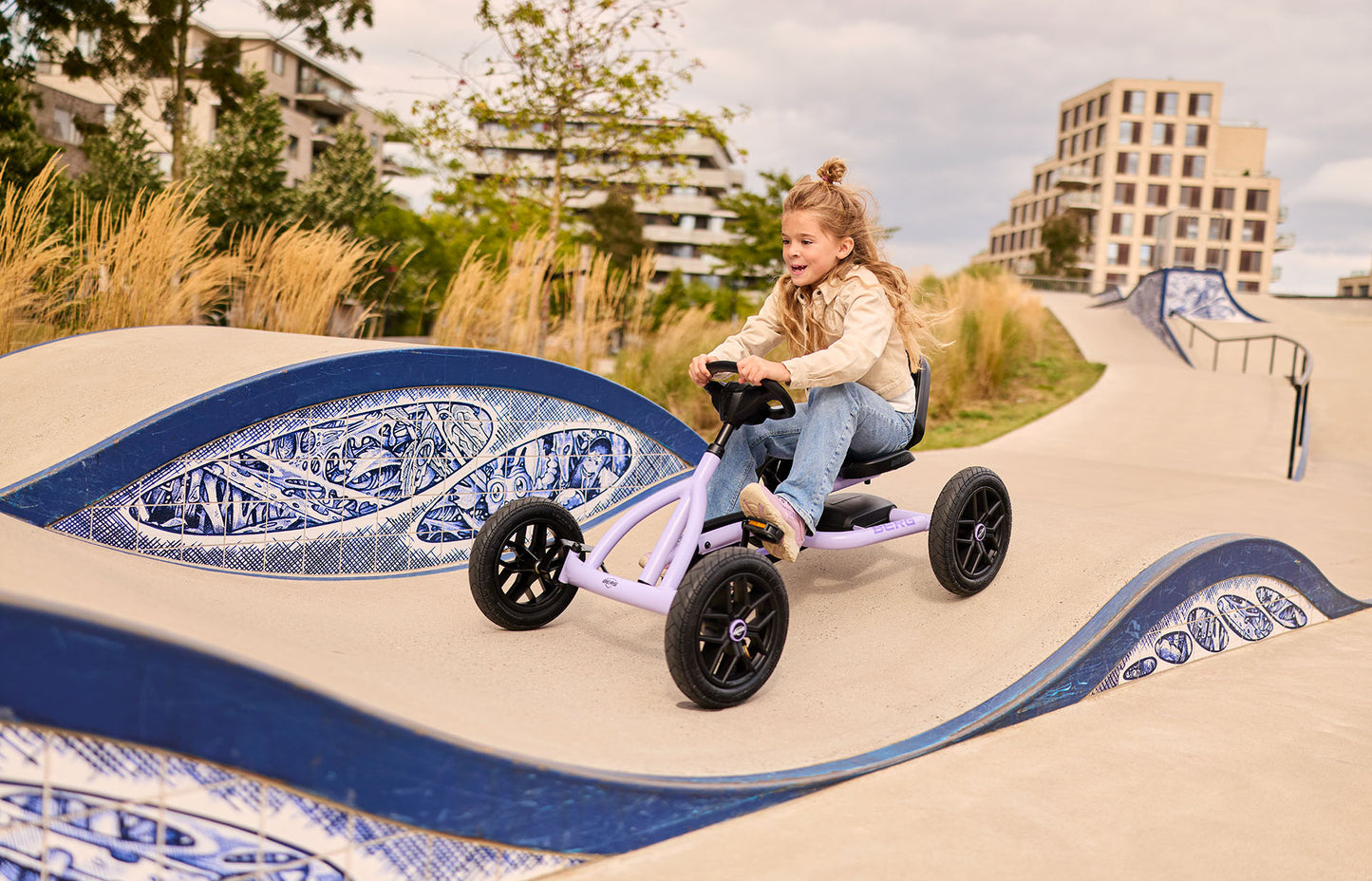 kids playing outside with BERG Buddy Purple go kart active outdoor play and fun