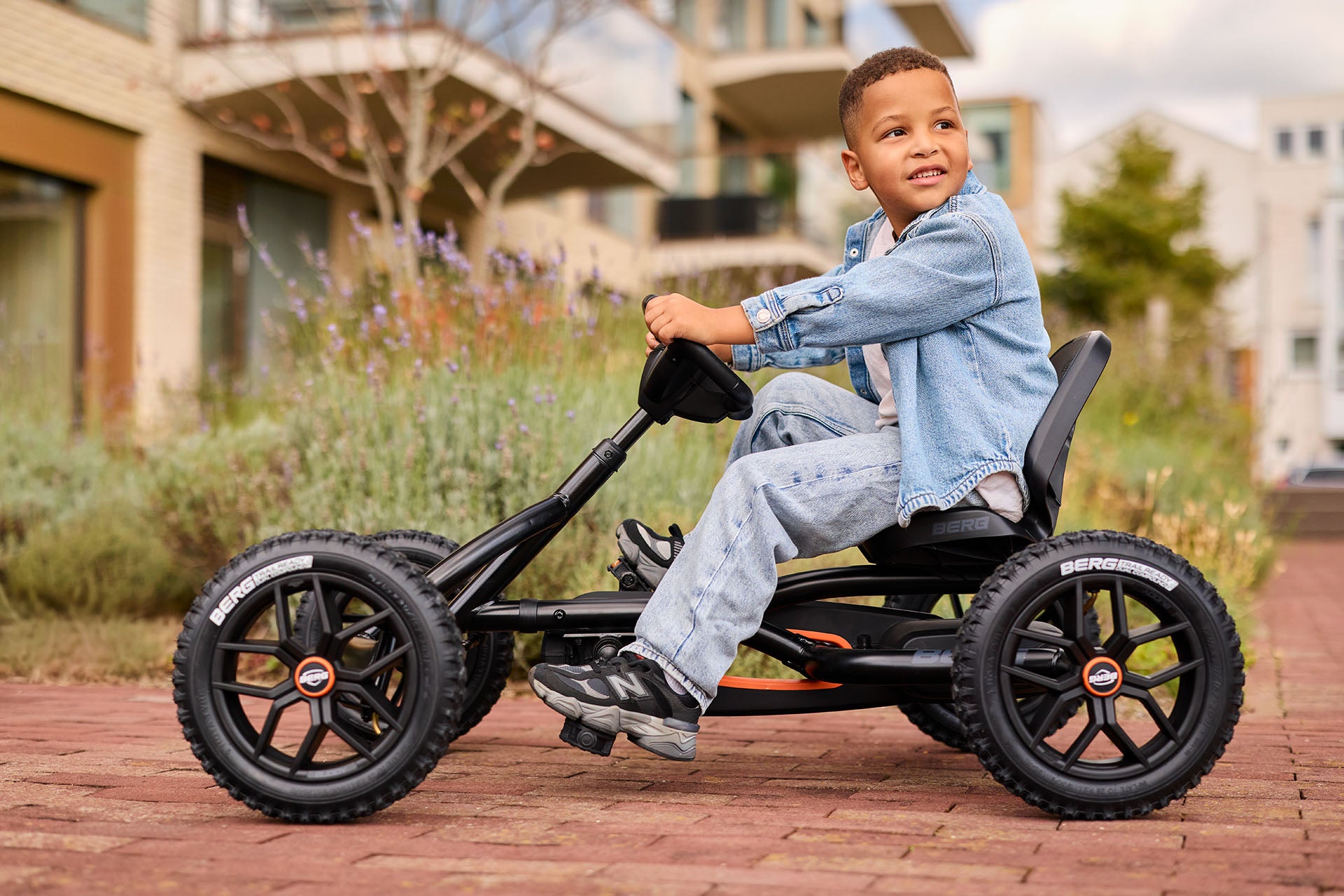 children enjoying outdoor play with BERG Buddy Cross Black pedal go kart fun active lifestyle