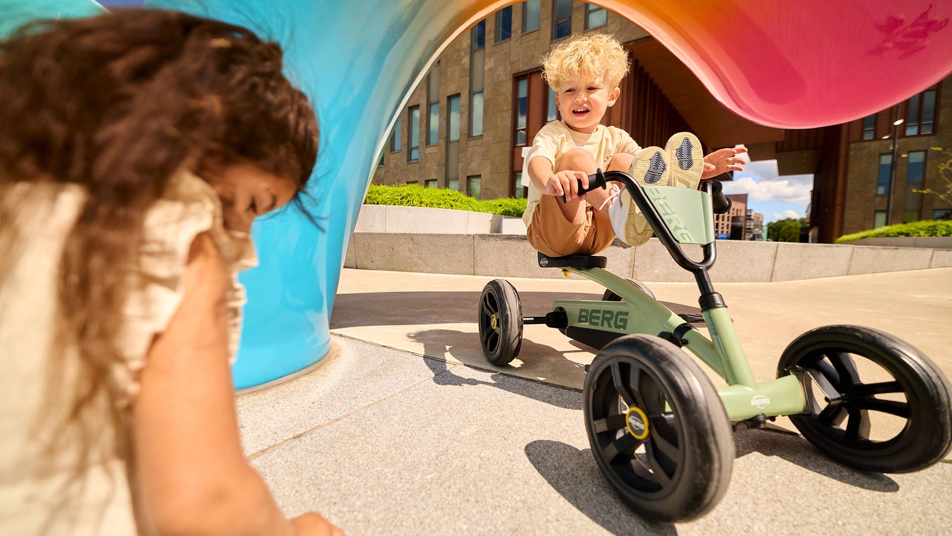 BERG Buzzy Green go-kart during family garden playtime