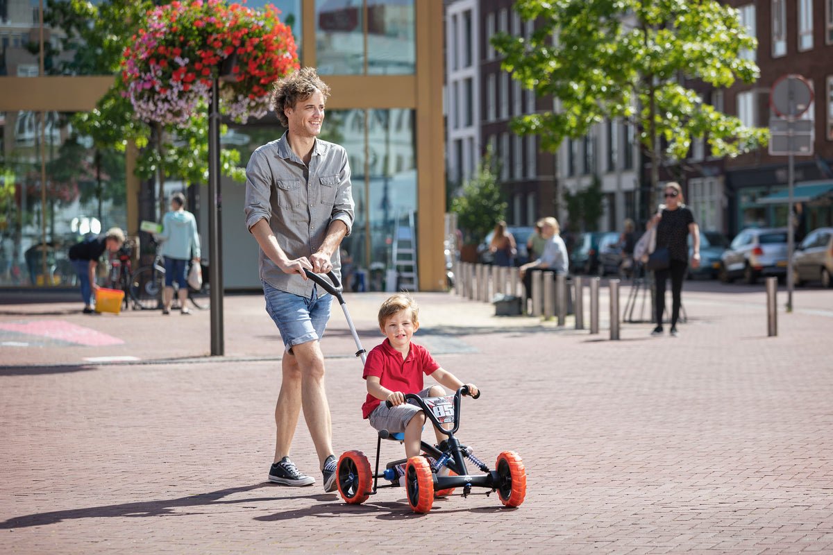 Child riding BERG Buzzy Nitro 2-in-1 go-kart outdoors