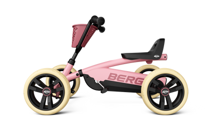 Side angle of the BERG Buzzy Pink ride-on go-kart with adjustable steering wheel