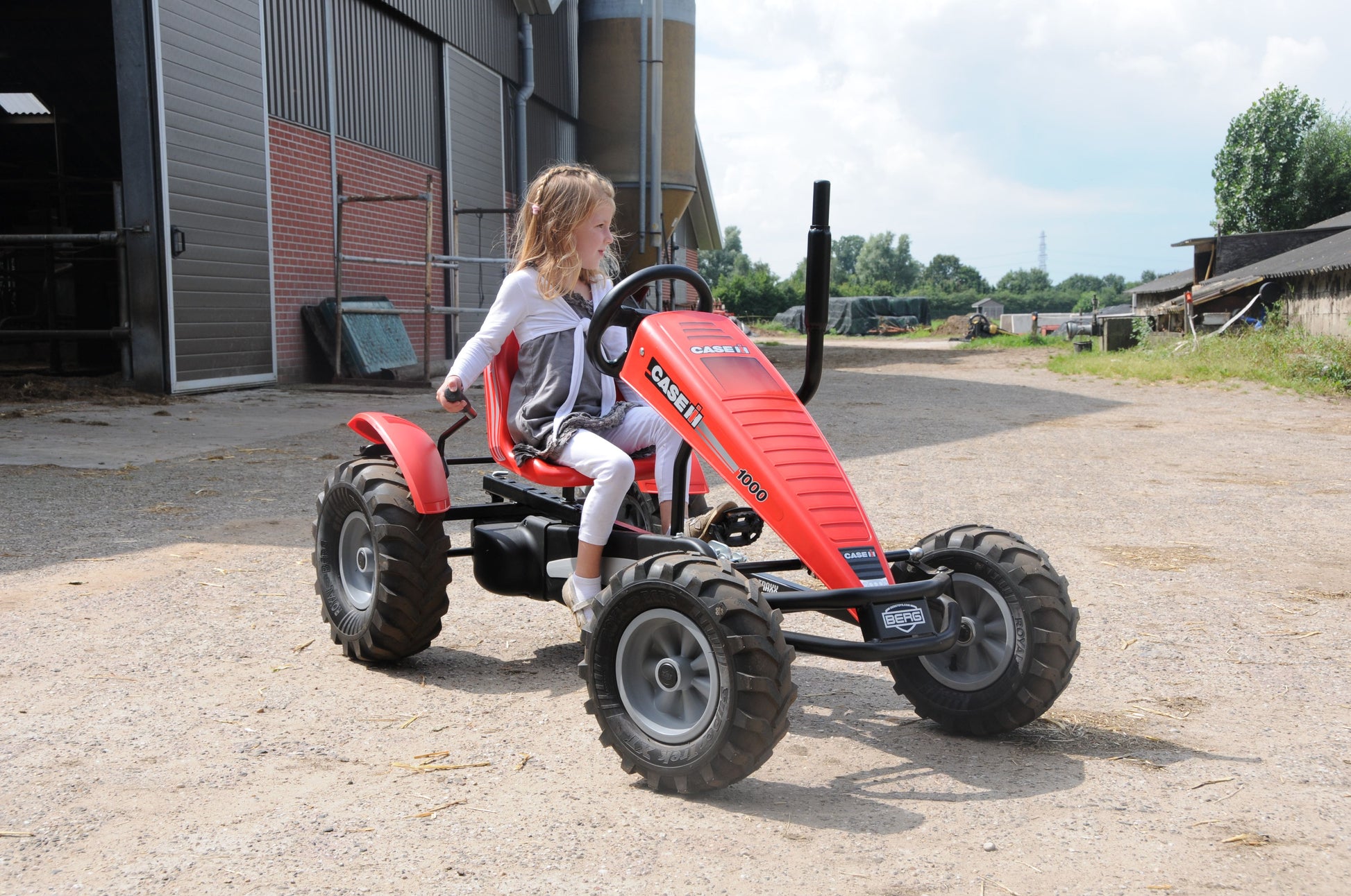 Outdoor farm play with BERG Case Tractor pedal tractor