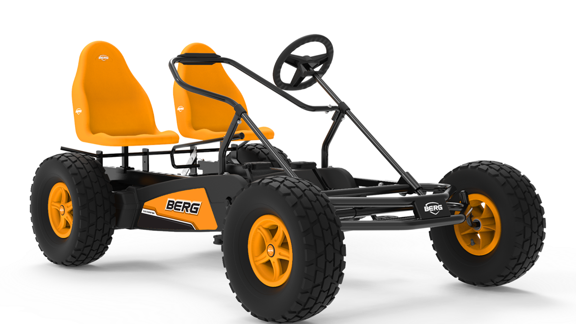 Two children riding BERG Duo Coaster pedal go-kart outdoors