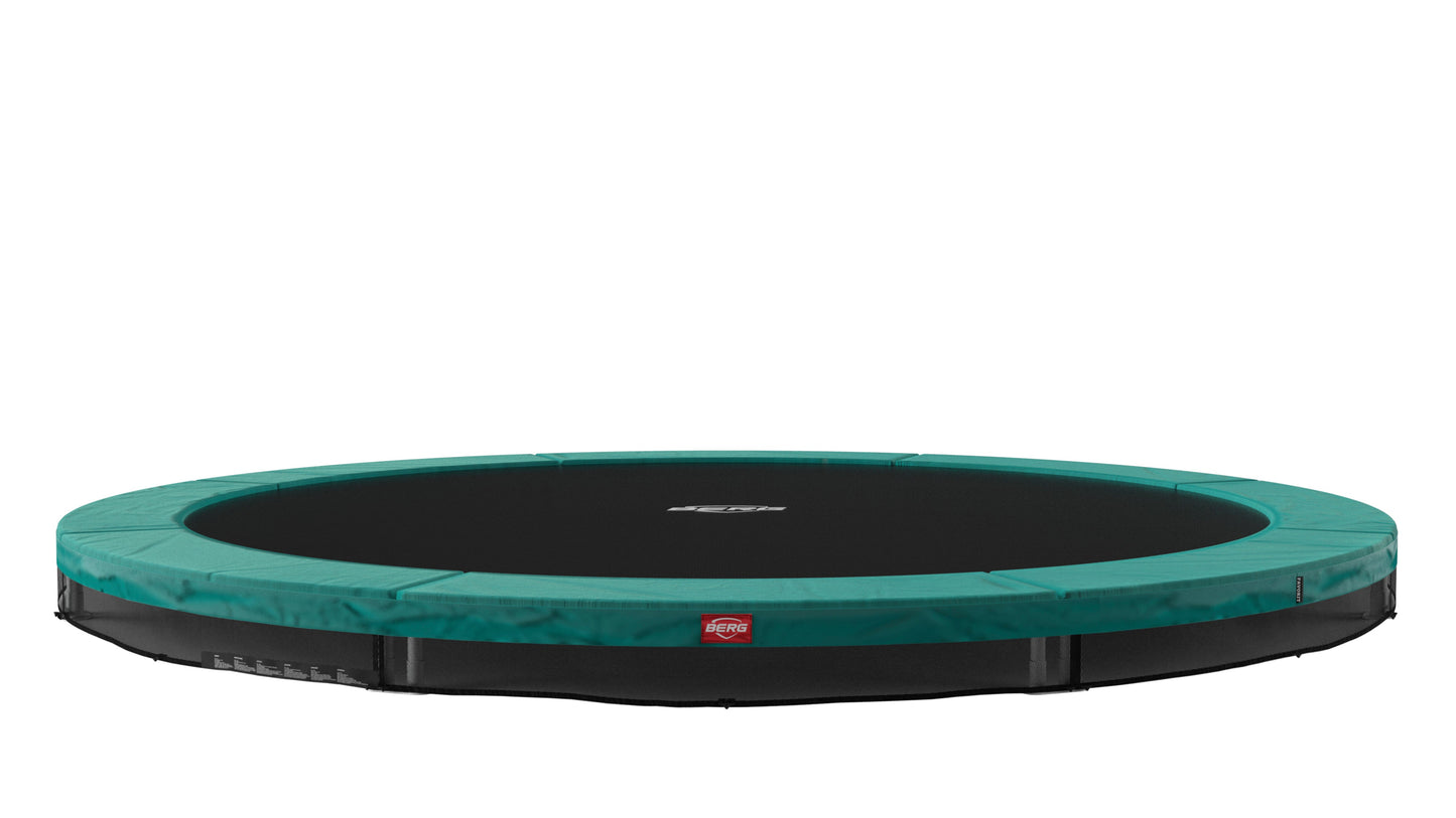 Kids enjoying BERG Favorit InGround trampoline outdoor play