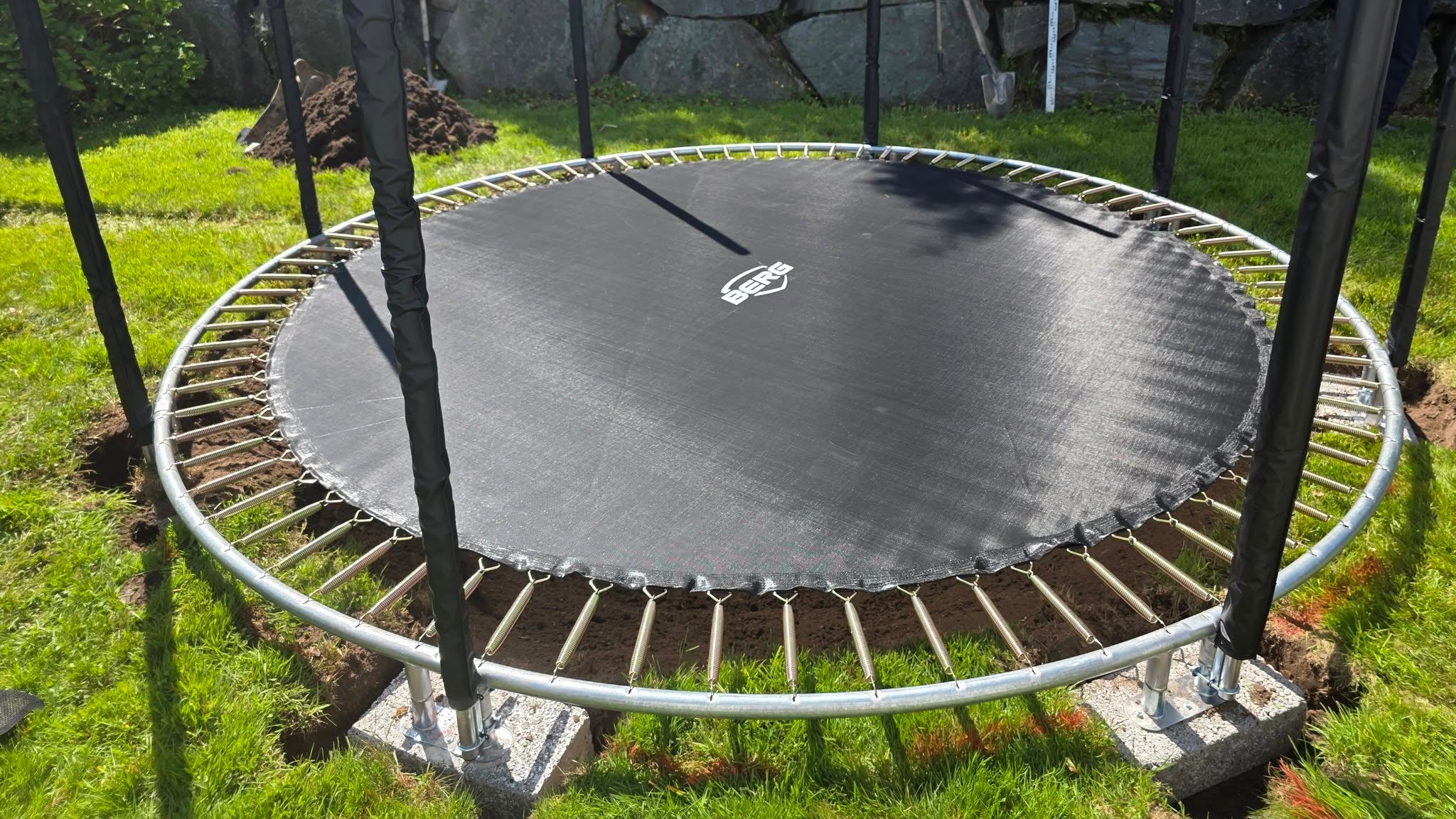  Assembling the metal frame and securing the low-profile legs inside the dug hole