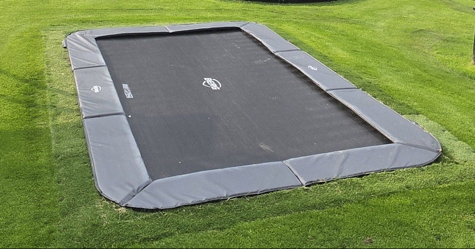BERG Ultim Champion FlatGround in-ground trampoline in garden