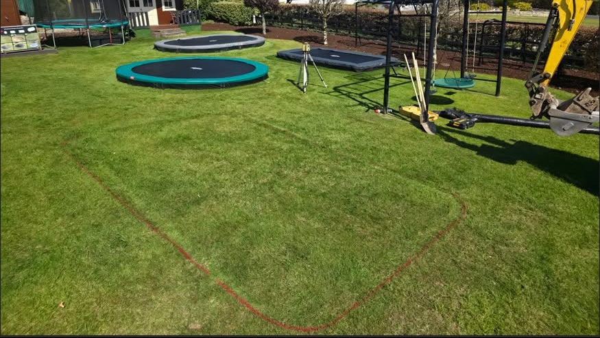 Pristine lawn space at our show site before installing a Berg Ultim Champion rectangular inground trampoline.