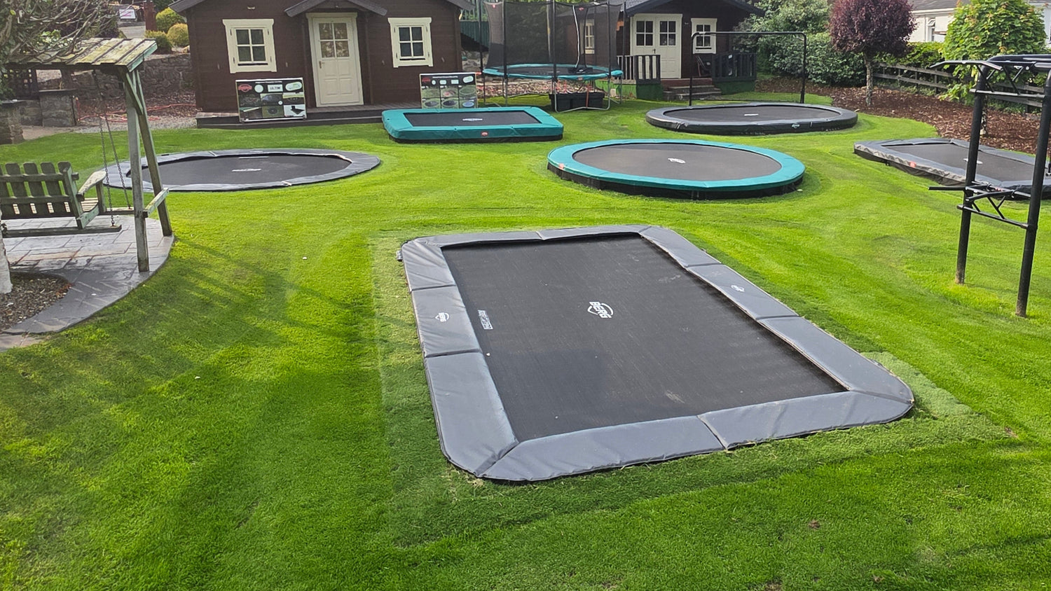 The finished Berg Ultim Champion rectangular inground trampoline fully installed flush with the ground at our show site
