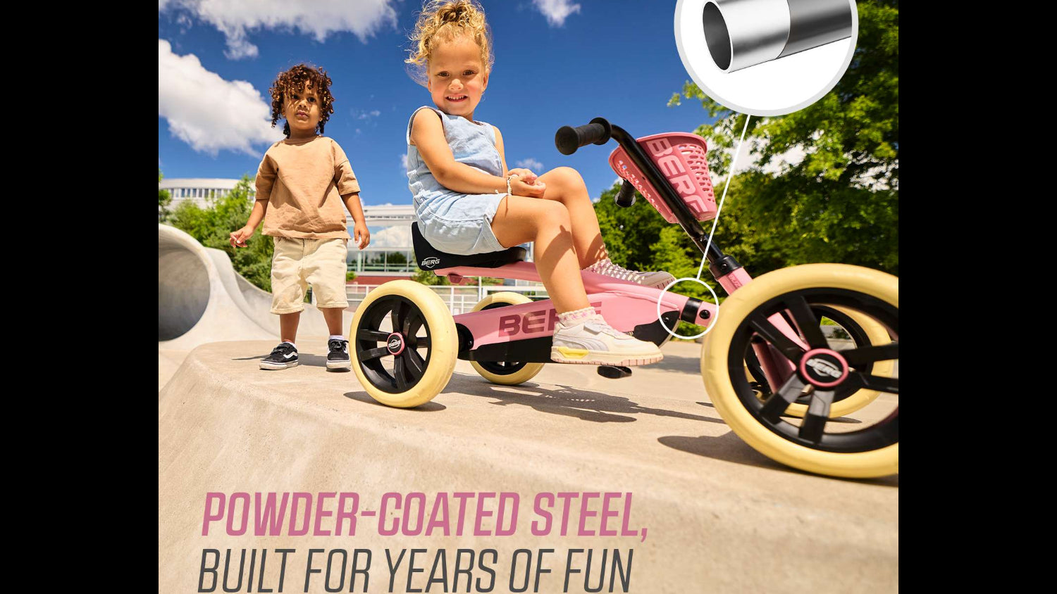 Toddler riding a pink BERG Buzzy pedal kart on a garden path